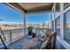 Relaxing covered deck with patio furniture and neighborhood views at 9592 Keystone Trl, Parker, CO 80134