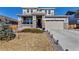 Beautiful two-story home with a well-manicured lawn and a two-car garage in a quiet suburban neighborhood at 9592 Keystone Trl, Parker, CO 80134