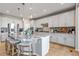 Spacious kitchen with white cabinets, granite countertops, stainless steel appliances, and hardwood floors at 9592 Keystone Trl, Parker, CO 80134