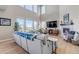 Beautiful living room featuring a large sofa, fireplace, television, and plenty of natural light at 9592 Keystone Trl, Parker, CO 80134