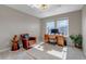 Home office with a wooden desk, comfortable chair, and large windows at 9592 Keystone Trl, Parker, CO 80134