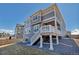 Two-story home with a gray exterior, a back deck, and a well-kept yard at 9592 Keystone Trl, Parker, CO 80134