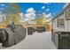 Spacious back deck features an outdoor grill and patio seating, perfect for entertaining at 4924 S Flower Way, Littleton, CO 80123