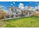 Enjoy a large, grassy backyard with spacious deck, great for relaxation and entertaining at 4924 S Flower Way, Littleton, CO 80123