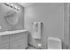 Bright bathroom with a vanity sink and a large bathtub at 4924 S Flower Way, Littleton, CO 80123