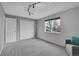 Neutral bedroom with a large window, and closet at 4924 S Flower Way, Littleton, CO 80123