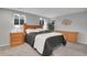 Well-lit bedroom featuring coordinated furniture, creating a serene and inviting atmosphere at 4924 S Flower Way, Littleton, CO 80123
