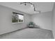 Bright bedroom with a large window and seating area at 4924 S Flower Way, Littleton, CO 80123