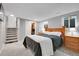 Main bedroom with closet, egress window, and staircase at 4924 S Flower Way, Littleton, CO 80123