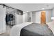 Spacious bedroom featuring modern design, with a sliding barn door closet and ample storage at 4924 S Flower Way, Littleton, CO 80123