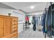 Walk-in closet with shelving, and a dresser next to a window with lots of natural light at 4924 S Flower Way, Littleton, CO 80123