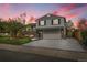 Charming two-story home with brick accents, a spacious driveway, and a well-manicured lawn at 4924 S Flower Way, Littleton, CO 80123