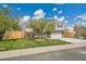 Charming two-story home with brick accents, a spacious driveway, and a well-manicured lawn at 4924 S Flower Way, Littleton, CO 80123