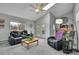 Living room features ample seating, skylights and access to the backyard at 4924 S Flower Way, Littleton, CO 80123