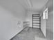 Clean shed interior with tile floor, wire shelving, and ample natural light from a window at 4924 S Flower Way, Littleton, CO 80123