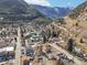 Scenic aerial view of the community surrounded by mountains, lush forests, and winding roads at 710 6Th St, Georgetown, CO 80444