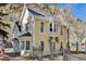 Charming yellow two-story home with bay windows and mountain views at 710 6Th St, Georgetown, CO 80444