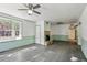 Bright living space features wood floors, a fireplace, and windows showcasing outside light at 710 6Th St, Georgetown, CO 80444