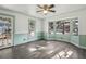 Sun-drenched living area with bay windows, original wood floors, and natural light at 710 6Th St, Georgetown, CO 80444