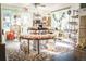 Retail space with a large display table, goods for sale, and wood floors at 710 6Th St, Georgetown, CO 80444