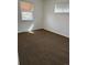 Bright room with a large window and neutral carpet providing natural light at 1125 S Eaton Ct, Lakewood, CO 80232