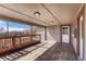 Relaxing covered porch overlooking the fenced yard, ready for entertaining at 3090 W Longfellow Pl, Denver, CO 80221