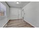 Bedroom with wood-look flooring, white walls, and windows for ample natural light at 3090 W Longfellow Pl, Denver, CO 80221