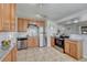 Well-equipped kitchen with stainless steel appliances, granite countertops, and ample cabinet space at 3090 W Longfellow Pl, Denver, CO 80221