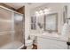 Cozy bathroom featuring shower, toilet, vanity with mirror and neutral color palette at 9383 Cobblecrest Dr, Highlands Ranch, CO 80126