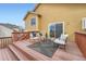 Wood deck featuring lounge furniture, including cushioned chairs, a bench, and a center table, creating an inviting outdoor space at 9383 Cobblecrest Dr, Highlands Ranch, CO 80126