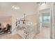 Bright entryway showcases the staircase and a view of the dining area with lots of natural light at 9383 Cobblecrest Dr, Highlands Ranch, CO 80126