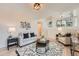 Open-concept living room featuring modern decor and staircase to the upper level at 9383 Cobblecrest Dr, Highlands Ranch, CO 80126