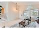 Cozy living room with high ceilings, natural light, and hardwood floors at 9383 Cobblecrest Dr, Highlands Ranch, CO 80126