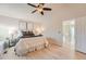 Relaxing main bedroom featuring a ceiling fan, and a doorway that leads into a hallway at 9383 Cobblecrest Dr, Highlands Ranch, CO 80126