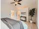 Inviting main bedroom featuring a ceiling fan, and seamless transition into a bright bathroom at 9383 Cobblecrest Dr, Highlands Ranch, CO 80126