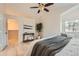 Inviting main bedroom features a ceiling fan, and flows into a walk in closet at 9383 Cobblecrest Dr, Highlands Ranch, CO 80126