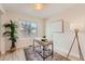 Functional home office with a modern desk, comfortable chair, and large window for a productive workspace at 9383 Cobblecrest Dr, Highlands Ranch, CO 80126