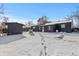 Spacious backyard with storage shed and snow-covered ground at 2756 S Hooker St, Denver, CO 80236