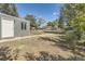 The backyard has grass, mature trees, and a fenced perimeter at 5330 S Windermere St, Littleton, CO 80120