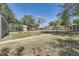 This spacious backyard features a chain link fence, trees, and grass at 5330 S Windermere St, Littleton, CO 80120