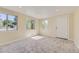 Sun-filled bedroom with neutral walls, plush carpeting, and multiple windows for abundant light at 5330 S Windermere St, Littleton, CO 80120