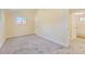 Bedroom with neutral walls, plush carpeting, and a glimpse of the adjacent bathroom at 5330 S Windermere St, Littleton, CO 80120