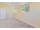Bright bedroom featuring neutral walls, plush carpeting, and natural light from two windows at 5330 S Windermere St, Littleton, CO 80120