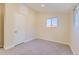This bedroom has natural light, neutral walls, white trim, and gray carpet at 5330 S Windermere St, Littleton, CO 80120