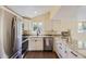 Contemporary kitchen featuring stainless steel appliances and granite countertops at 5330 S Windermere St, Littleton, CO 80120