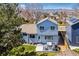 Charming two-story home showcasing a backyard patio with seating, perfect for relaxing and enjoying the outdoors at 10518 Hyacinth Pl, Highlands Ranch, CO 80129