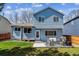 Backyard with concrete patio, outdoor seating, BBQ, and grassy area at 10518 Hyacinth Pl, Highlands Ranch, CO 80129