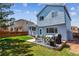 Large, green backyard with a patio perfect for entertaining or relaxing outdoors at 10518 Hyacinth Pl, Highlands Ranch, CO 80129