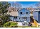 Charming two-story home showcasing a backyard patio with seating, perfect for relaxing and enjoying the outdoors at 10518 Hyacinth Pl, Highlands Ranch, CO 80129