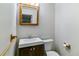 This renovated bathroom features a new vanity with a modern faucet and new lighting at 10518 Hyacinth Pl, Highlands Ranch, CO 80129